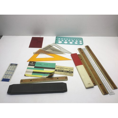 1111 - Collection of slide rules and technical drawing equipment.