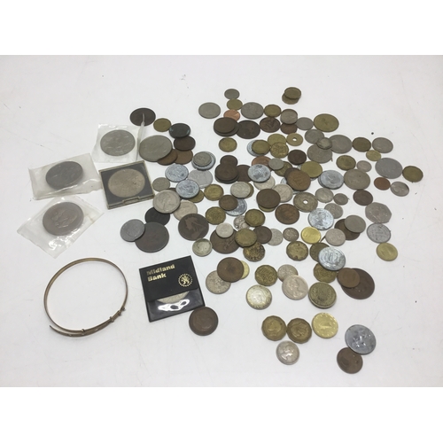 529 - Mixed coins including some silver, commemorative coins and a rolled gold bangle