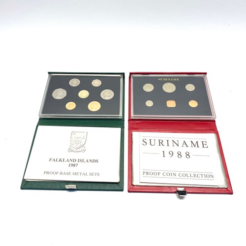 662 - 2 Royal Mint proof coinage collections in leather bound displays including: Suriname 1988 and Falkla... 