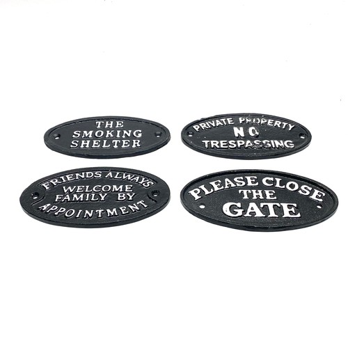 670 - 4 Heavy cast iron wall plaques.