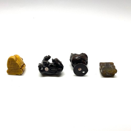 701 - Four Netsukes including one possibly jade