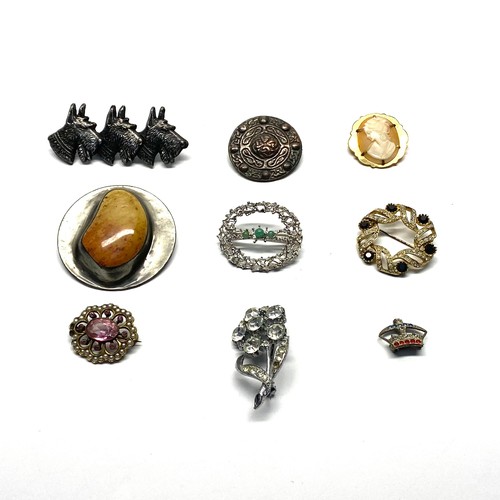 710 - Eight vintage brooches including a handmade Jasper palm and scotty dog.