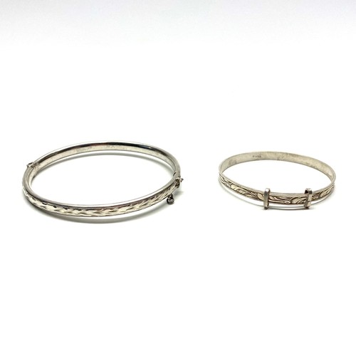 715 - Silver bangle and child's extendable bangle.