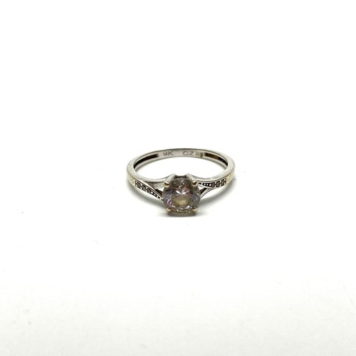 954 - 9ct gold ring with large CZ stone and stones to the shoulders. 1.5g