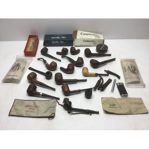 1098 - A large selection of pipes and tobacco related items