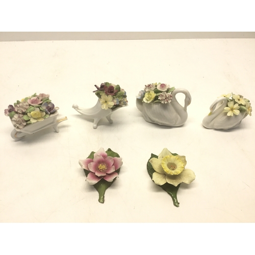 753 - Four Royal Doulton posy baskets and two ceramic lilies