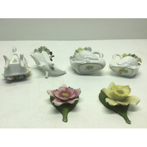 753 - Four Royal Doulton posy baskets and two ceramic lilies