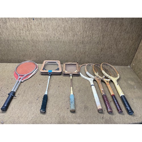 1110 - Collection of vintage tennis and badminton rackets.