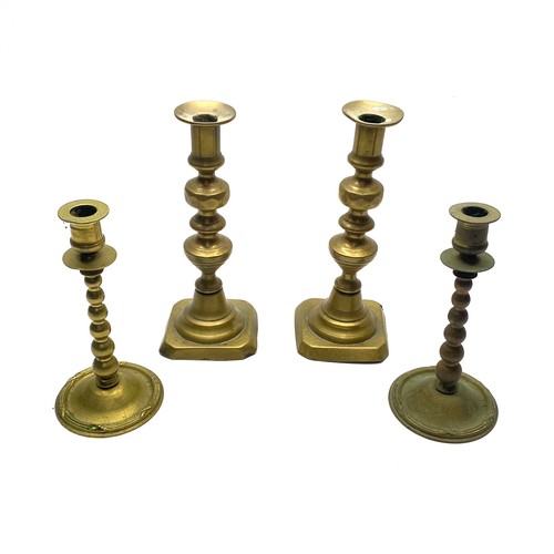 452 - 4 brass candle sticks.