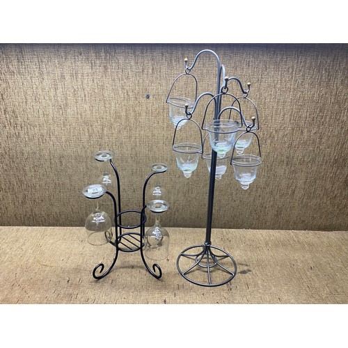 25 - Four wine glasses on a stand with a bottle holder and six hanging candles