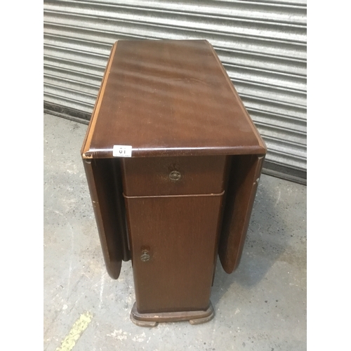 61 - Drop leaf table with drawers and cupboard beneath