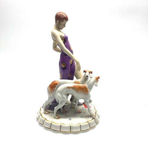 709 - Royal Dux Art Deco figure of a maiden wearing a flapper dress with two Borzoi dogs. Pink RD stamp to... 