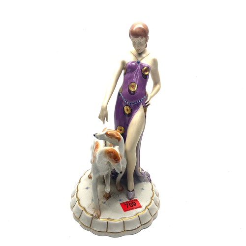 709 - Royal Dux Art Deco figure of a maiden wearing a flapper dress with two Borzoi dogs. Pink RD stamp to... 