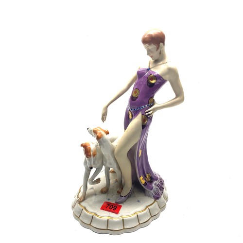 709 - Royal Dux Art Deco figure of a maiden wearing a flapper dress with two Borzoi dogs. Pink RD stamp to... 