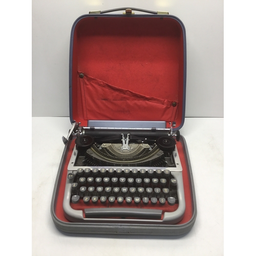 82 - Cased portable typewriter by Harrison and Fowler Ltd