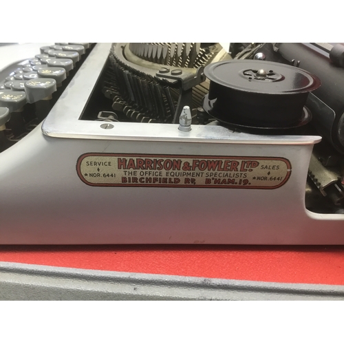 82 - Cased portable typewriter by Harrison and Fowler Ltd