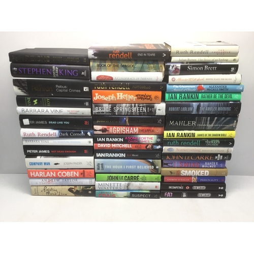 104 - A quantity of hardback books including Ian Rankin, John Le Carre and Peter James