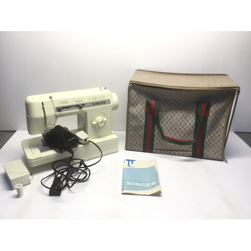 145A - Singer sewing machine 2515C in a protective carry case