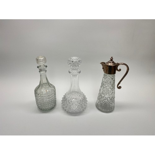 471 - 2 crystal decanters and a crystal and silver plate claret.