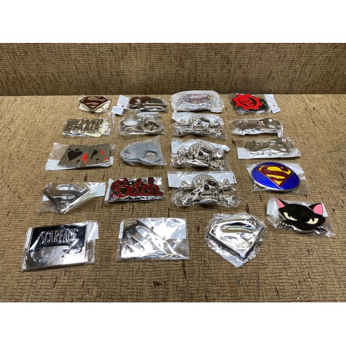 476 - mixed collection of belt buckles including superman, scarface and dc comics.