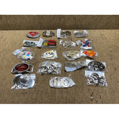 477 - mixed collection of belt buckles including batman, spiderman,golf and worlds greatest beer drinker.