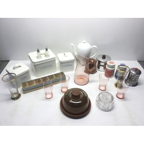 200 - Vintage kitchen items including shot glasses, cloche and metal tea and coffee containers