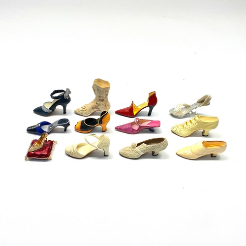 493 - mixed collection of ornamental shoes by raine willitts.