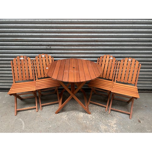 219 - round wooden garden table with 4 chairs.