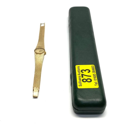 873 - 9ct gold ladies Omega Deville oval  face watch and strap. Running when booked in. Total weight with ...