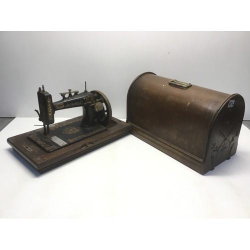 85C - Early Atlas D sewing machine made in USA in a decorative wooden case