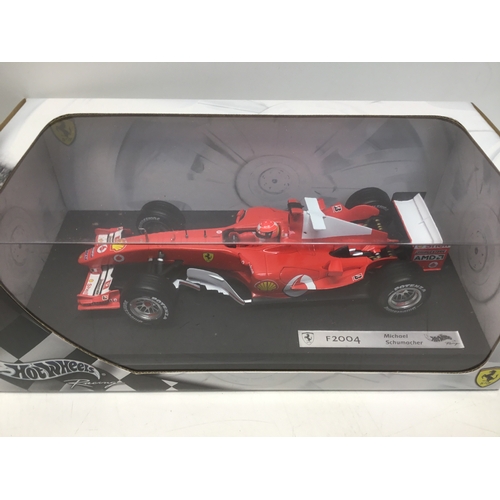 762 - Two Hotwheels Michael Schumacher die cast cars 2004 2005