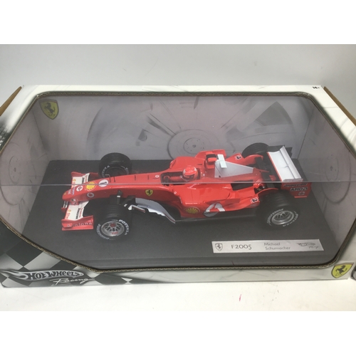 762 - Two Hotwheels Michael Schumacher die cast cars 2004 2005