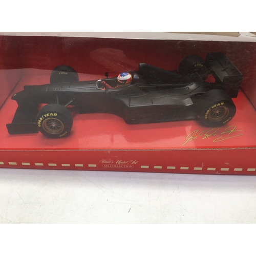 766 - Michael Schumacher Ferrari test car limited edition 1998 plus a display case