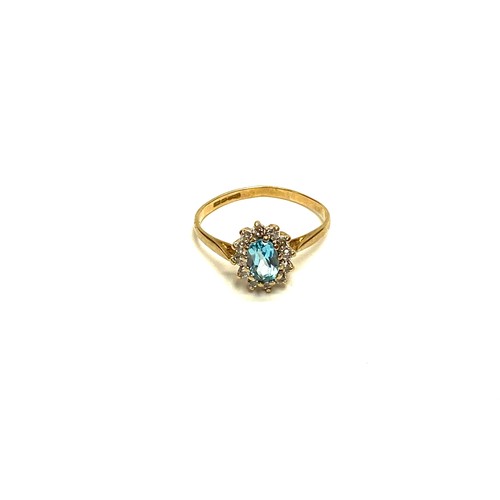 851 - 9ct gold ring with large aqua marine stone and CZ. 1.5g and size N.