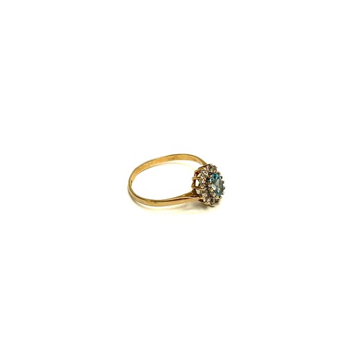 851 - 9ct gold ring with large aqua marine stone and CZ. 1.5g and size N.