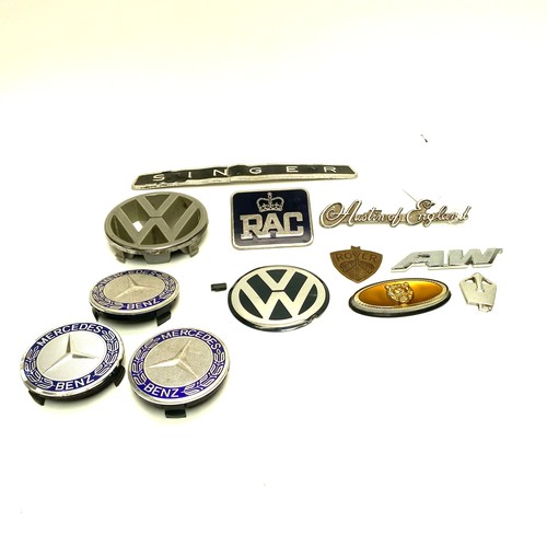 855 - Collection of car badges including: Volkswagen, Jaguar and Austin.