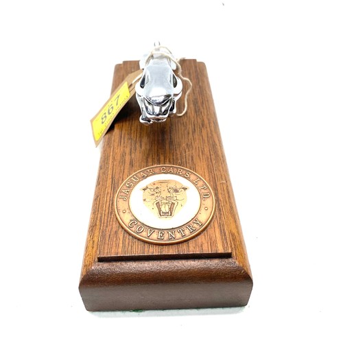 867 - Jaguar car mascot mounted on a wooden base.
