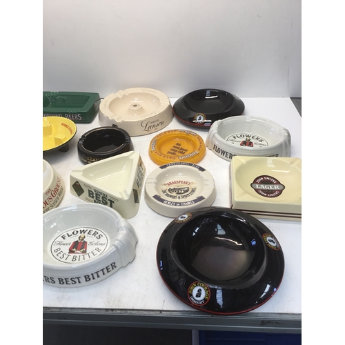 1122 - A collection of sixteen vintage pub ashtrays including Flowers and Double Diamond