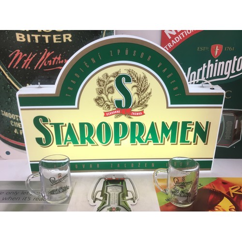 1125 - A working Staropramen light up pub sign including two pint glasses and a selection of pub posters