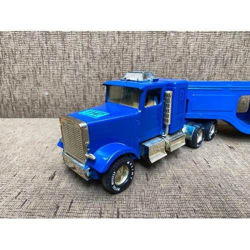 1147 - Nylint Metal muscle model semi-truck with vehicle trailer.