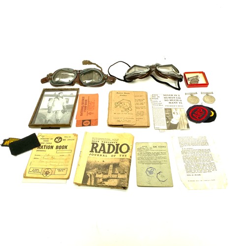 942 - Interesting collectors investigative lot. Two pairs of flying google with a picture, Silver ARP badg... 