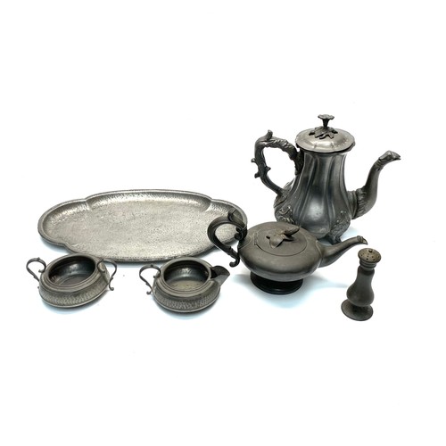 833C - Collection of pewter including a coffee pot by J Wolsten, Derry and Toms sugar bowl and jug, pepper ... 