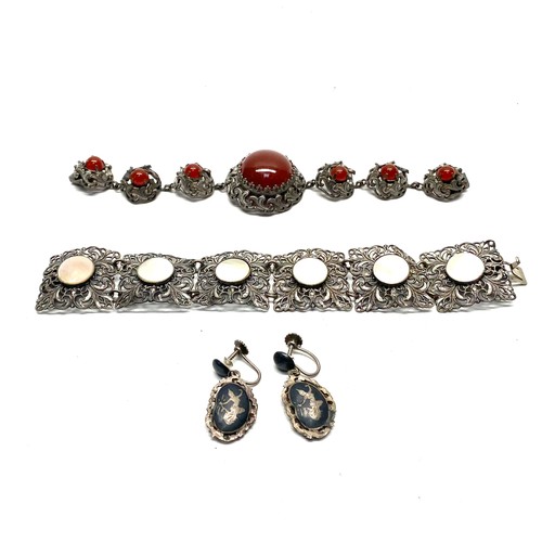 834E - Bracelet with semi precious stone,  probably red cabochon carnelian and a fine filigree with mother ... 