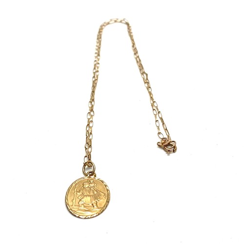 951 - 9ct gold saint Christopher and chain. 1.7g