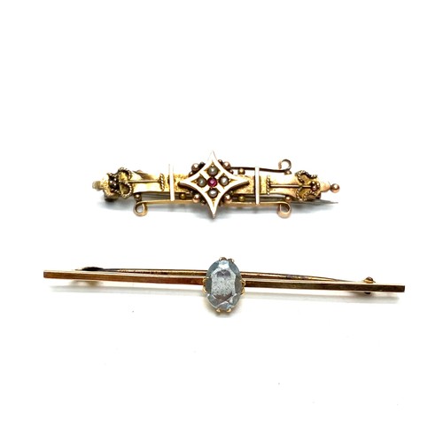 957 - Gold brooch's one with seed pearl with slight damage to rear (NHM) & one 9ct Aquamarine. 4.1g