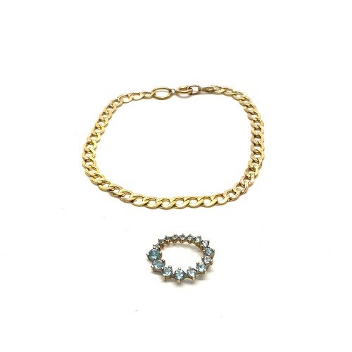959 - Delicate 9ct gold bracelet and a 9ct gold pendant with aquamarine stones 2.5 grams total weight