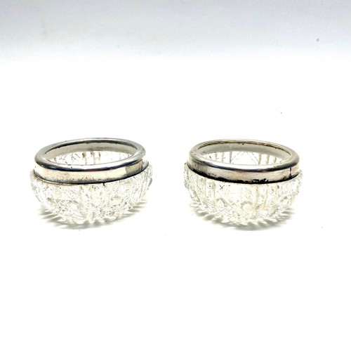 969 - Two lead crystal salts/trinket pots with silver rims. Hallmarks for London 1919 by Wolfsky & Co Ltd,... 