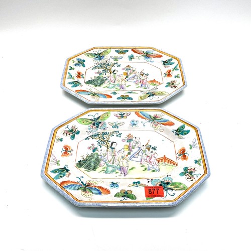 877 - A pair of Chinese serving plates depicting court scenes and decorated with butterflies