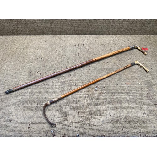 884 - Antique walking stick with deer antler handle and silver collar and a riding crop with silver collar