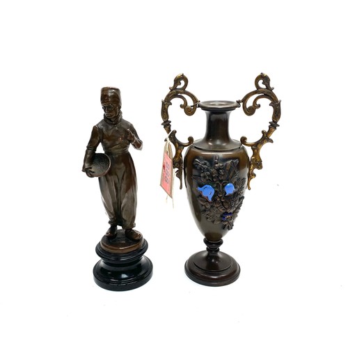 888 - Bronze figure of a dutch boy with pipe and bowl and a bronze bud vase with handles and enamel decora... 